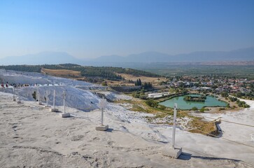Pamukkale (Turkish: Cotton Castle or Cotton Fortress) is a Turkish town located in the Cürüksu Valley. It is famous for the limestone deposits formed on the slopes of Cökelez Mountain.