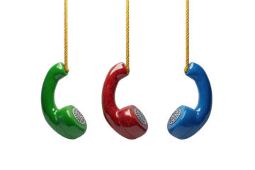 Colorful rotary phone receivers hanging by gold cords, against a black background