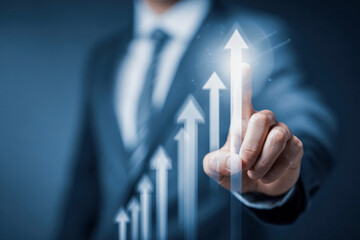Businessman in suit pointing at glowing virtual graph with upward arrows symbolizing growth and success in a modern digital interface environment