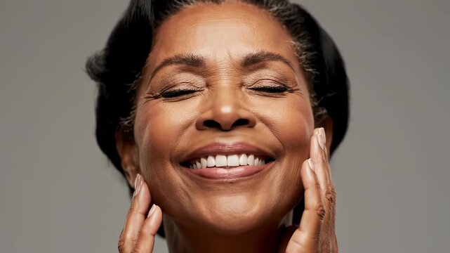 Closeup portrait of a beautiful, smiling african american senior woman with her eyes closed, touching her face with her hands, conveying a sense of peace and contentment vector illustration