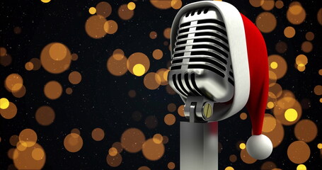 Image of yellow spots over microphone with santa hat