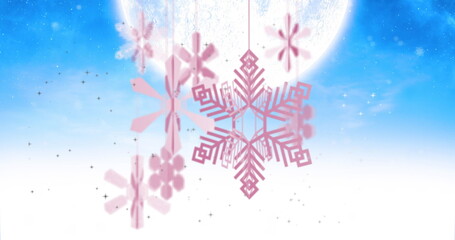 Image of snowflakes over moon and snow falling