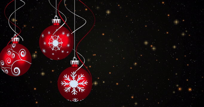 Naklejki Image of yellow stars over christmas baubles