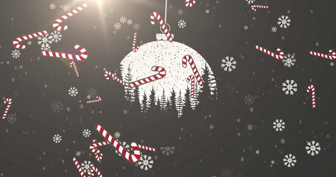 Naklejki Image of candy cane falling over christmas decorations