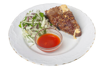 Grilled Meat with Onion Salad and Red Sauce on a White Plate isolated