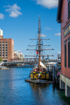 Boston, MA - US - Oct 2, 2025 A replica sailing ship, the Brig Beaver, is docked at the Boston Tea Party Ships and Museum in Boston, Massachusetts and a bridge in the background.