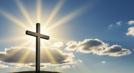 Wooden cross on a grassy hill with glowing sun rays against a partly cloudy blue sky symbolizing hope and faith
