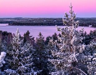 Winter landscape with snowy pine trees, frozen lake, and pink sunset sky in serene mountain scenery