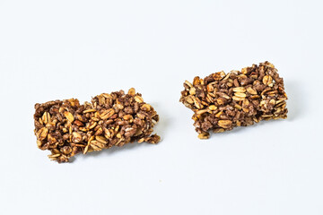Granola Bars isolated on white background. pile, stack. High protein snack. close up view. clipping path. Broken, half. two.