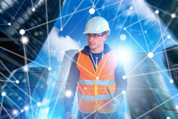 Construction worker in helmet and safety vest with digital network overlay, concept of smart city,...