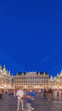 The Grand-Place (Grote Markt) day to night transition timelapse hyperlapse in Brussels, Belgium. Brabantine Gothic Town Hall, Maison Grand-Place and tourists in the historic city center after sunset