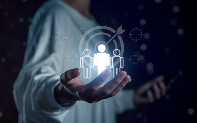 Target audience concept with glowing human icons and digital targeting graphic, symbolizing customer segmentation, marketing strategy, and personalized business communication in a digital environment.