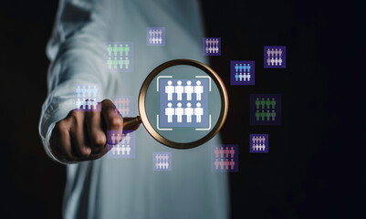 Target audience concept showing a person using a magnifying glass to highlight a specific group of people, symbolizing customer segmentation, audience analytics, and business targeting.