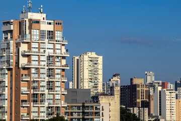 The exterior of modern condominiums is used full of glass, including sliding doors, windows and...