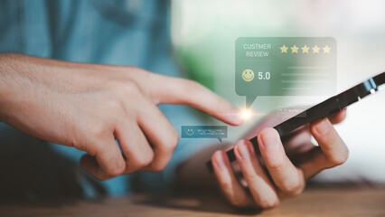 Customer satisfaction and online review concept showing hand using smartphone with 5-star rating. Symbol of positive feedback, quality service, trust, reputation, and successful business marketing.