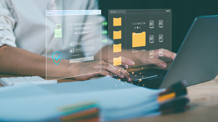 Cybersecurity and data protection concept with person using laptop and hologram interface showing secure login, encrypted folders, and cloud system. Symbol of privacy, safety, information security.