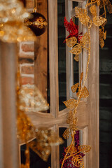 beautifully arranged display featuring golden ornaments and decorative plants creates vibrant atmosphere, enhancing festive spirit in cozy indoor space. vertical. close up.