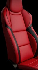 Luxury red car seat with black accents on a black background.