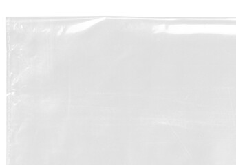 Fototapeta premium plastic transparent cellophane bag on white background. The texture looks blank and shiny. The plastic surface is wrinkly and tattered making abstract pattern