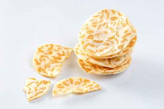 keripik tempe or crispy tempeh chips on a white background, a healthy and delicious snack.