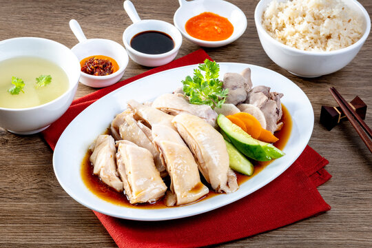 Singapore Hainanese Chicken Rice on the wooden table