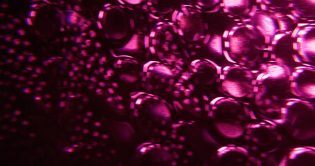 Defocused purple crystal. Shiny texture. Pink color round optical luminous lens flare on abstract...