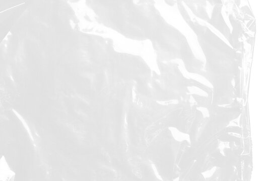 plastic transparent cellophane bag on white background. The texture looks blank and shiny. The plastic surface is wrinkly and tattered making abstract pattern