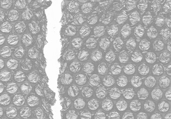 plastic transparent cellophane bag on white background. The texture looks blank and shiny. The plastic surface is wrinkly and tattered making abstract pattern