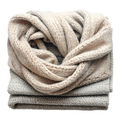 Folded knitted scarf and sweater are stacked neatly.