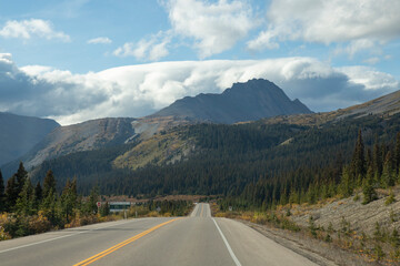 Open Road Leading to the Mountains, Freedom Travel Concept in the Canadian Rockies