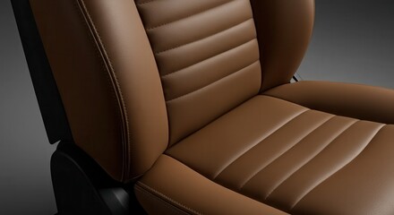 Close-up view of a brown leather car seat with stitching details.