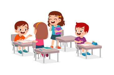 Happy elementary school kids studying together in classroom with cheerful expression