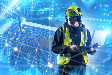 Electronics, Semiconductor Industry, Technology. Engineer in safety gear with laptop monitors microchip production process with futuristic digital interface and circuit board.