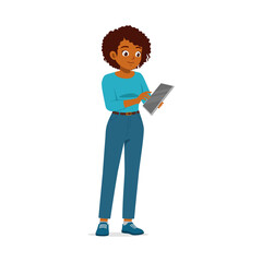 African American woman using tablet standing in blue casual wear with happy expression
