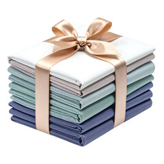 Stack of folded textiles is elegantly presented with a satin ribbon tie.
