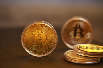 Close-Up of Bitcoin Coins in Focus with Blur Effect on Dark Background Reflecting Cryptocurrency...