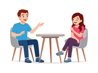 Two Young People Having a Conversation at a Table Man Explaining Something to Woman