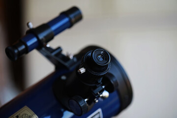 Close-Up of Blue Telescope with Focus on Eyepiece and Finder Scope for Astronomy Enthusiasts