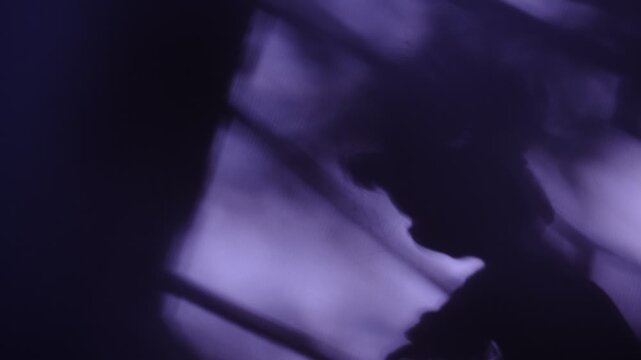 Shadow of Creepy doll, grunge, noise, soft blurred and cinematic. Horror. Mystery silhouette of scarecrow. Spooky