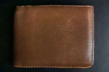 dark brown leather wallet, vintage purse , old grunge distressed texture, retro aged bifold, mock up decoration  