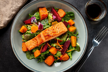 A vibrant dish of salmon and greens encouraging children to learn about healthy eating habits
