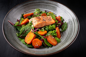 A wholesome plate of salmon and vegetables promoting mindful eating and youth health awareness
