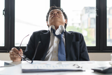 Stressed businessman concerning about financial debt.