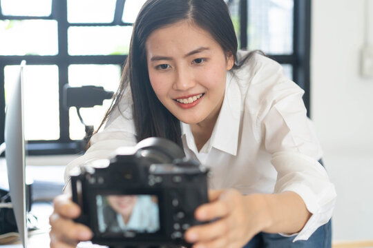 Influencer and content creator in digital marketing concepts. Young woman adjusting her digital camera prepare for record video content to her channel.