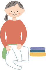 洗濯物を畳む女性