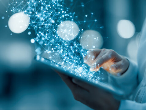Person using a digital tablet with interconnected glowing data network overlay representing advanced technology and futuristic communication concepts in blue tones