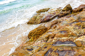 Amazing beach with rocks waves turquoise water in Patong Thailand.