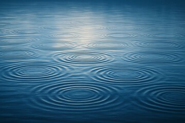 Obraz premium Blue water surface with soft concentric ripples and reflections under natural light, representing tranquility and harmony concept background. Ai generative