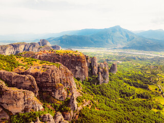 Fototapeta premium The monastery Meteora, aerial rocky monasteries complex in Greece near Kalabaka city. Holy Monastery of the Great Meteoron and Varlaam