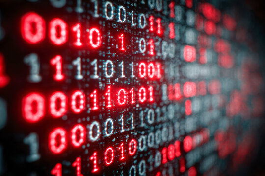Digital matrix of glowing red and white binary code numbers creating an abstract technology and data transmission background with a blurred depth effect - Powered by Adobe